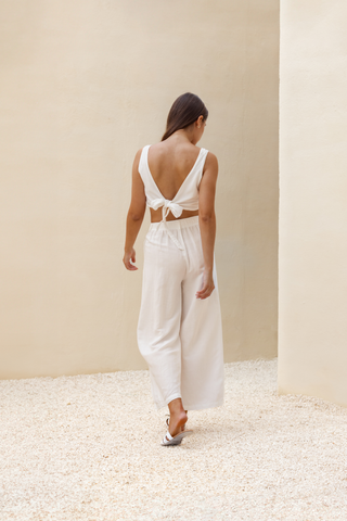 Rawbought Terra Wrap Top with adjustable tie closure and double-layered design for versatile styling, crafted from a luxurious linen-viscose blend, in sizes XS to XXXL in Coal and Sand.