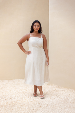 Rawbought Terra Linen Midi Tie-Back Dress featuring tie-back detail, elasticated waistband, and panelled seams, fully lined and made from soft linen blend, available in sizes XS to XXXL in monochromatic colours Coal and Sand.