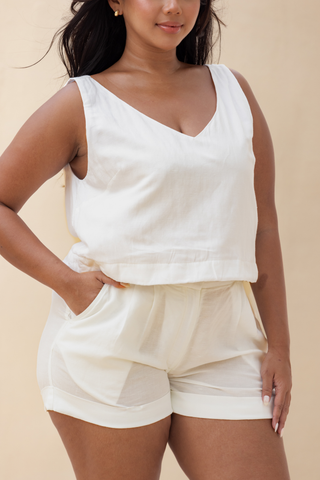 Rawbought Terra Tailored Shorts in high waist design with pockets and folded hem, offering a smart-casual look in lightweight soft linen blend, available in sizes XS to XXXL in monochromatic Coal and Sand