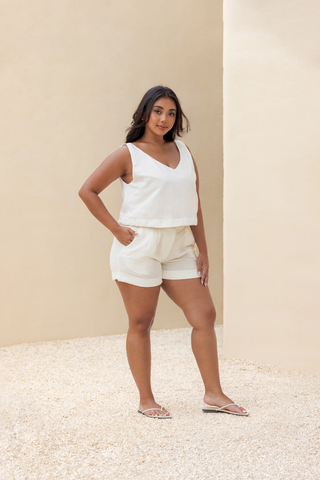 Rawbought Terra Tailored Shorts in high waist design with pockets and folded hem, offering a smart-casual look in lightweight soft linen blend, available in sizes XS to XXXL in monochromatic Coal and Sand