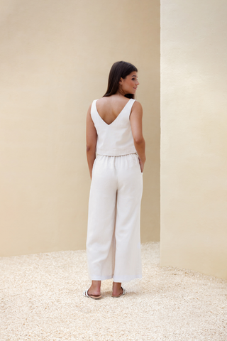 Rawbought Terra Wide Leg Trousers with high waist and flowing silhouette, featuring zipper, elasticated back, and pockets, crafted from soft linen blend, available in sizes XS to XXXL in Coal and Sand.