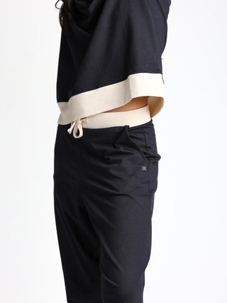 Unisex cotton-modal joggers with tapered legs, deep pockets, drawstring elasticated waist, and soft structure.