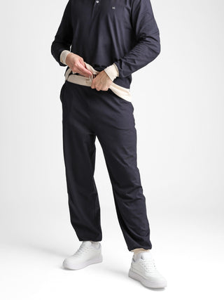Unisex cotton-modal joggers with tapered legs, deep pockets, drawstring elasticated waist, and soft structure.