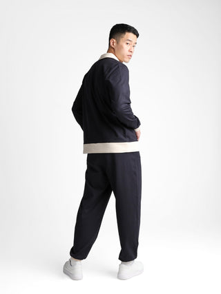 Unisex cotton-modal joggers with tapered legs, deep pockets, drawstring elasticated waist, and soft structure.