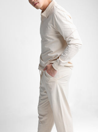 Unisex cotton-modal joggers with tapered legs, deep pockets, drawstring elasticated waist, and soft structure.