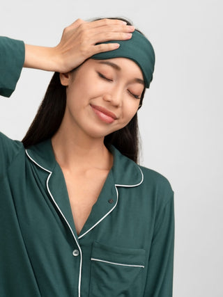 Woman wearing a green pajama set and matching headband by rawbought